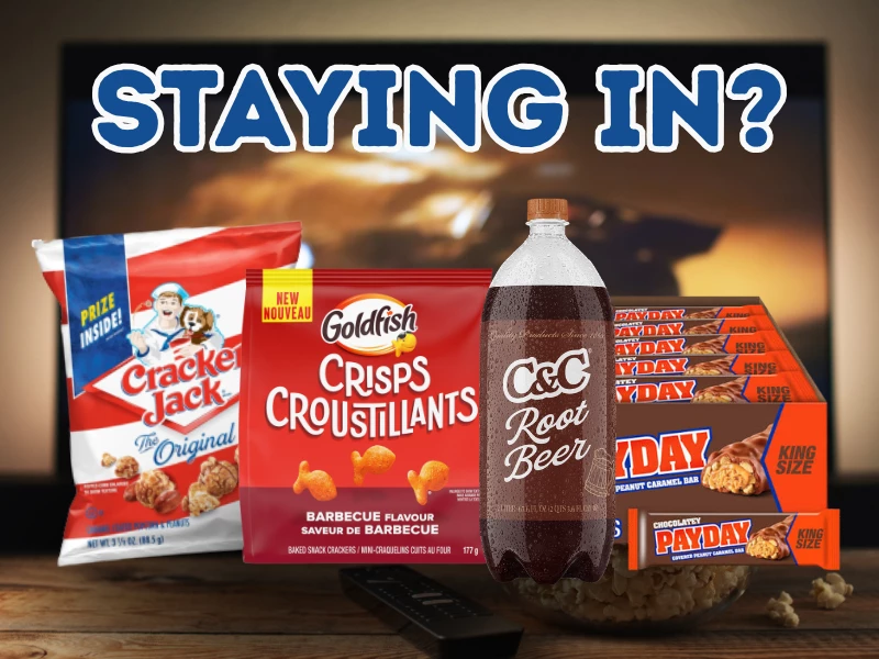 An American candy and drinks spread laid out for a night in on the sofa